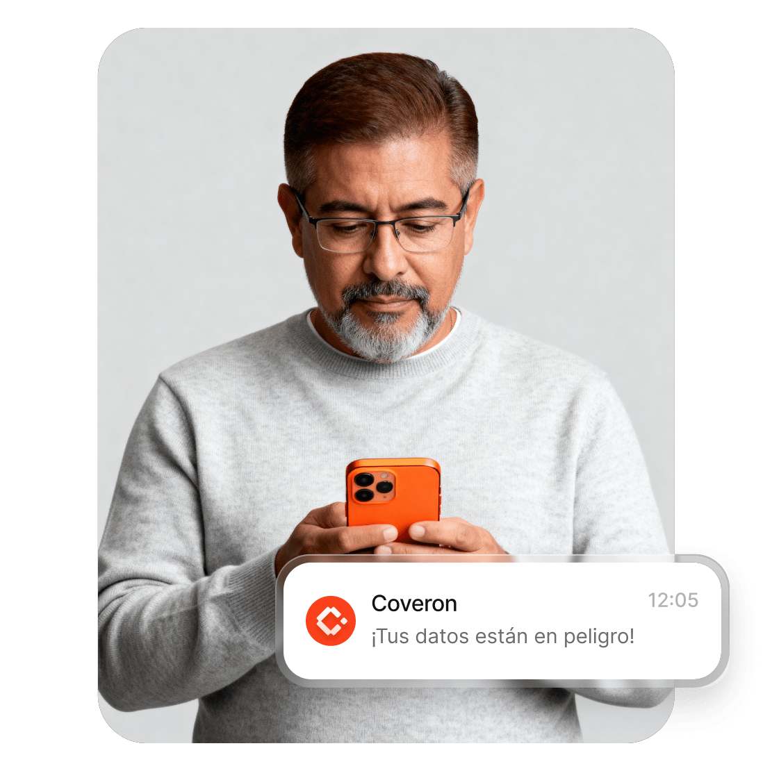 Un hombre usando un smartphone para leer la alerta de Coveron sobre el riesgo de que sus datos se hayan visto comprometidos.