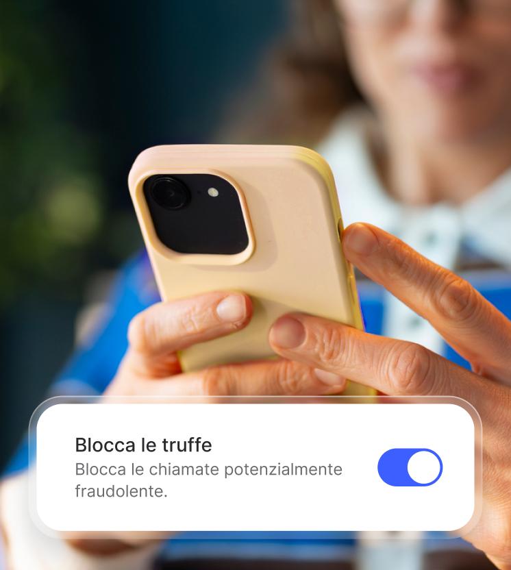 A woman enables the spam call blocker on her phone.