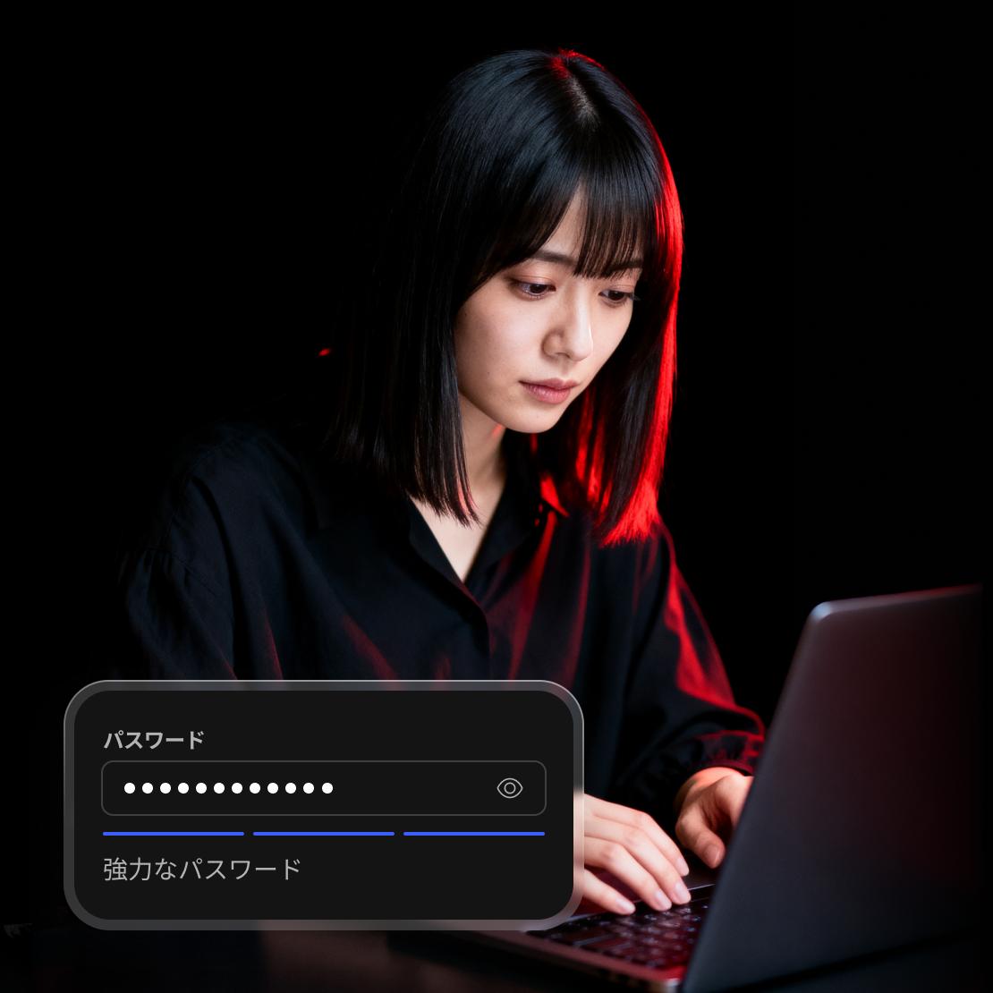 ノートパソコンでパスワードを変更している人。