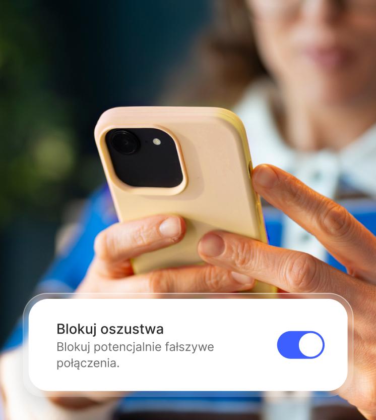 A woman enables the spam call blocker on her phone.