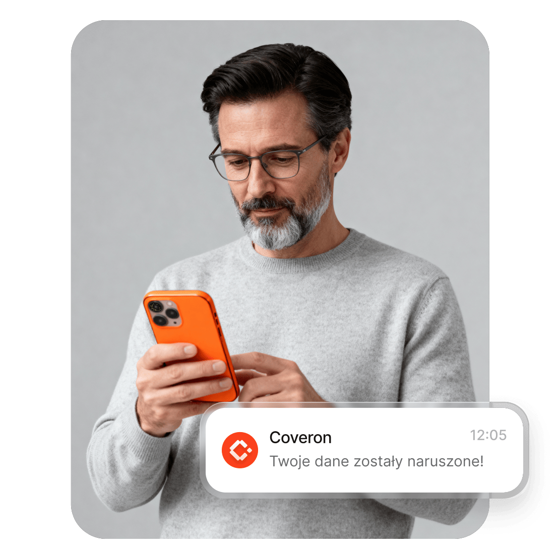 Mężczyzna czytający na smartfonie alert Coveron o naruszeniu bezpieczeństwa danych.