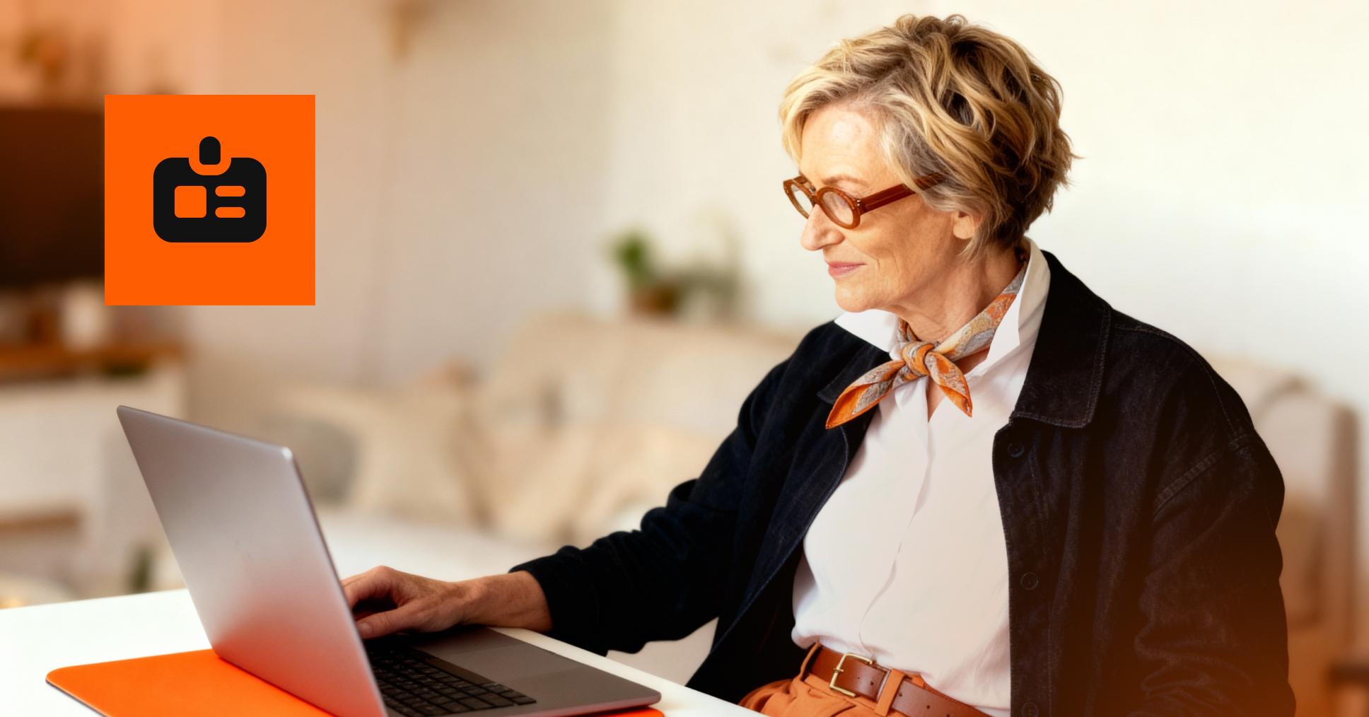 A person using their laptop to safeguard their email address from scammers.