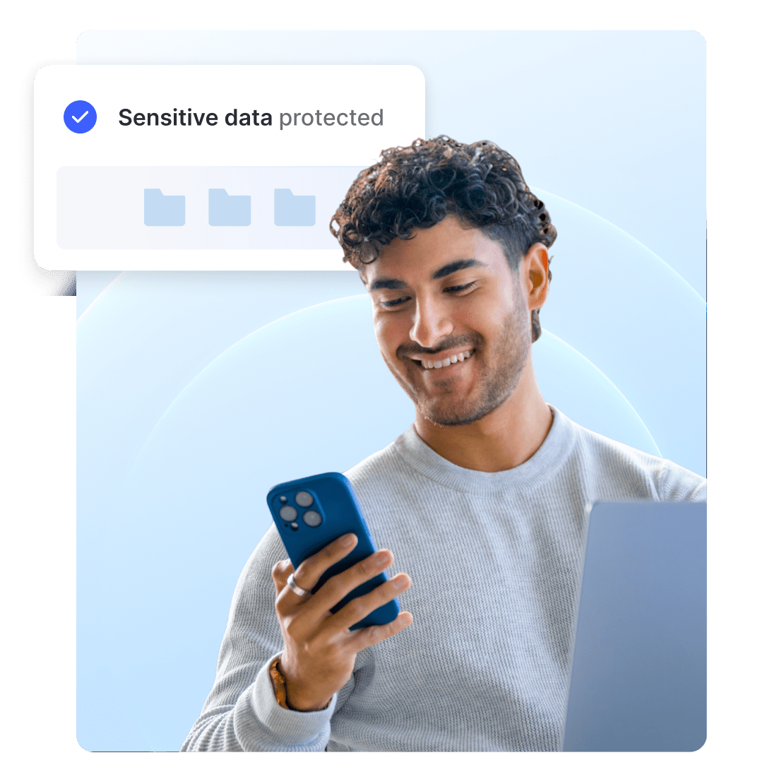A man browsing the web on a phone with a notification about secure sensitive data.