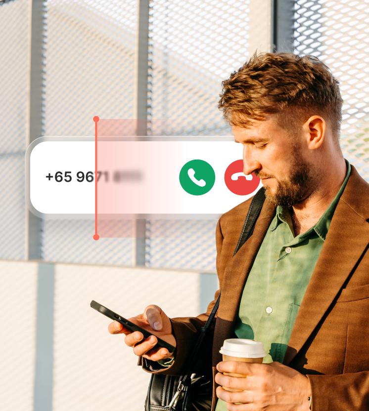 A man receives a suspicious call as the spam call blocker scans the caller’s number. 