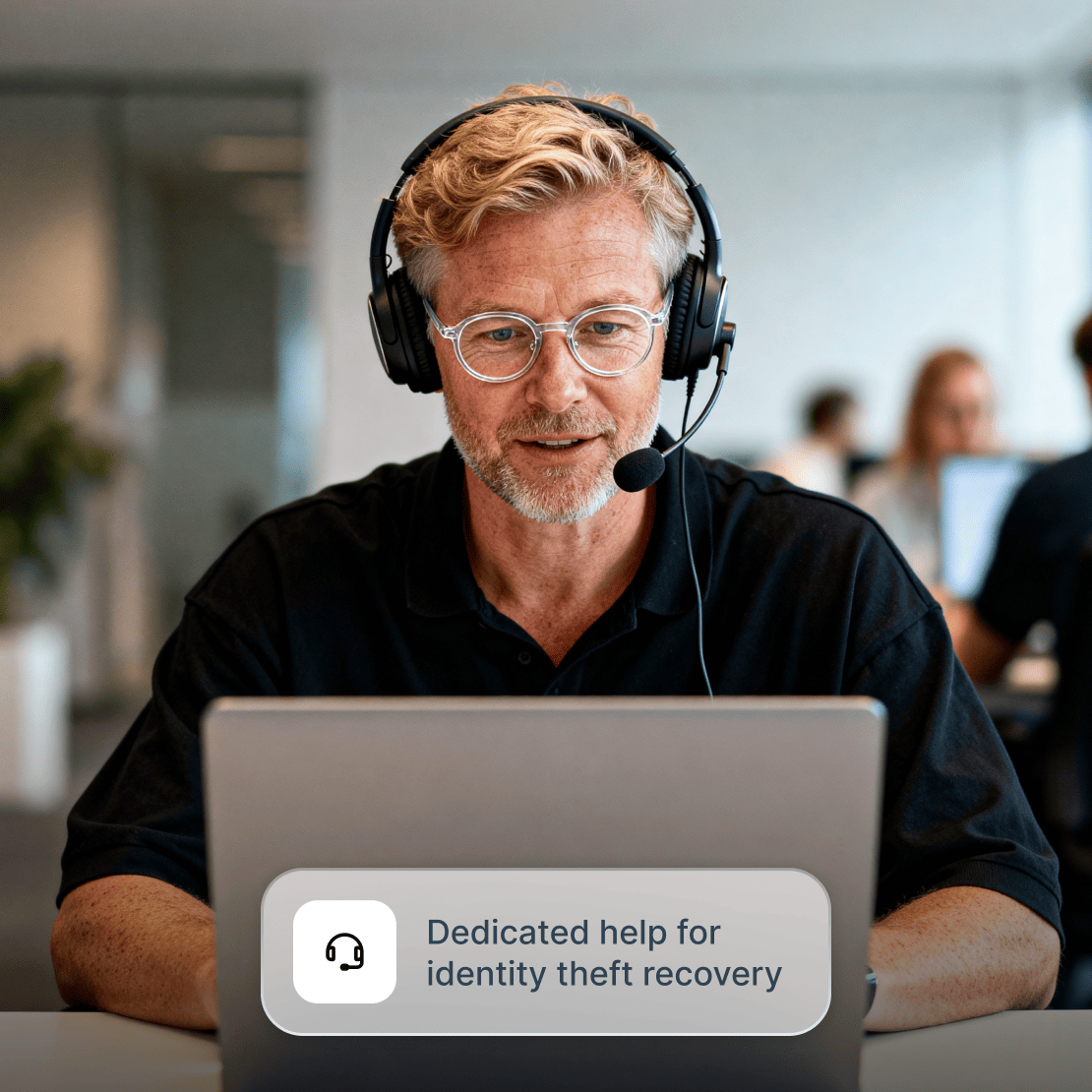 A Coveron expert offering identity theft recovery support through their laptop.