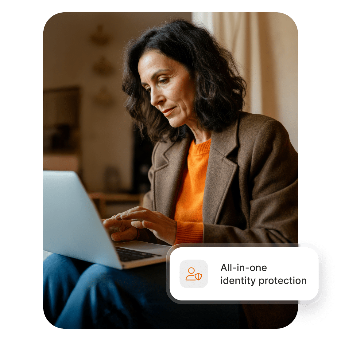 A woman using a laptop to check her identity theft insurance and cyber extortion insurance coverages.