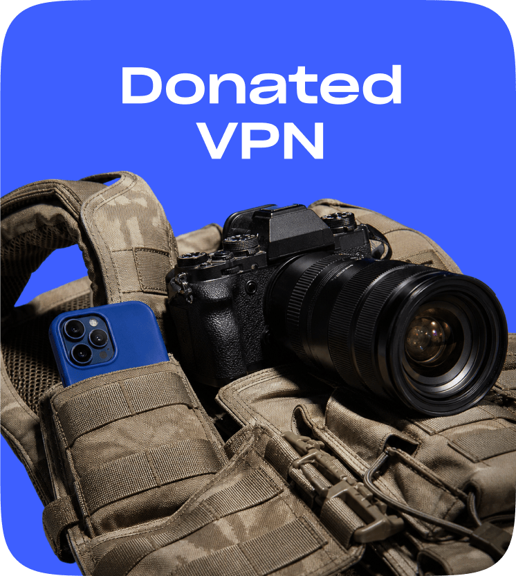 A camera and a phone tucked into a press flak jacket, captioned Donated VPN.