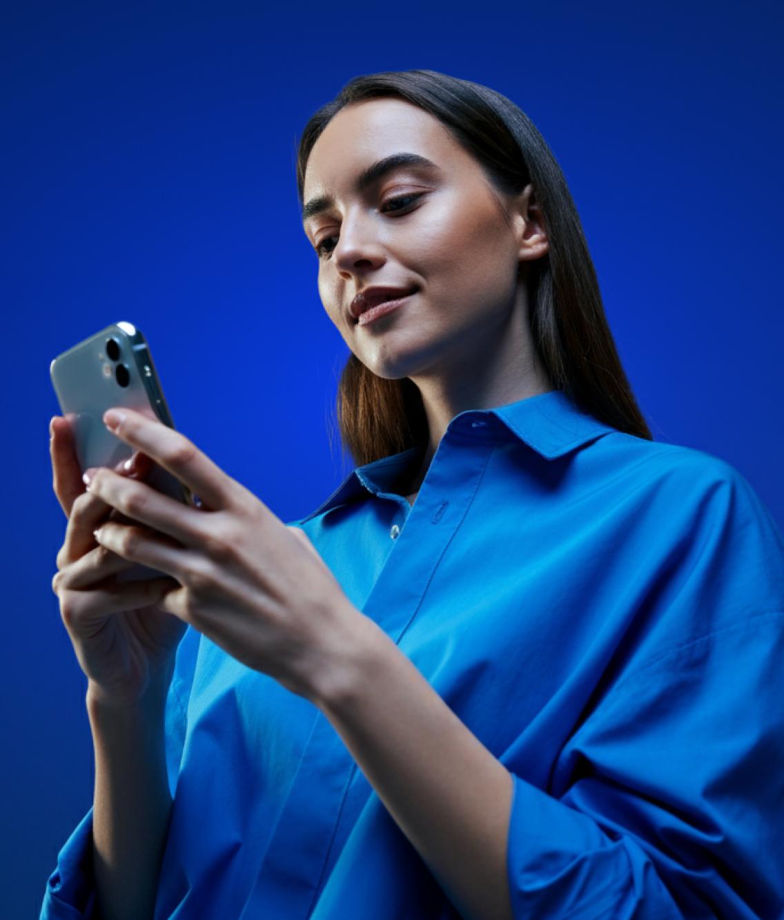 Woman using the NordVPN app on her phone.