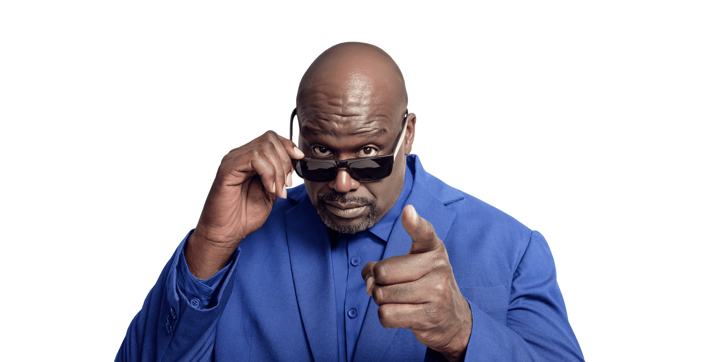 Shaquille O'Neal looking over his sunglasses and pointing at the camera.