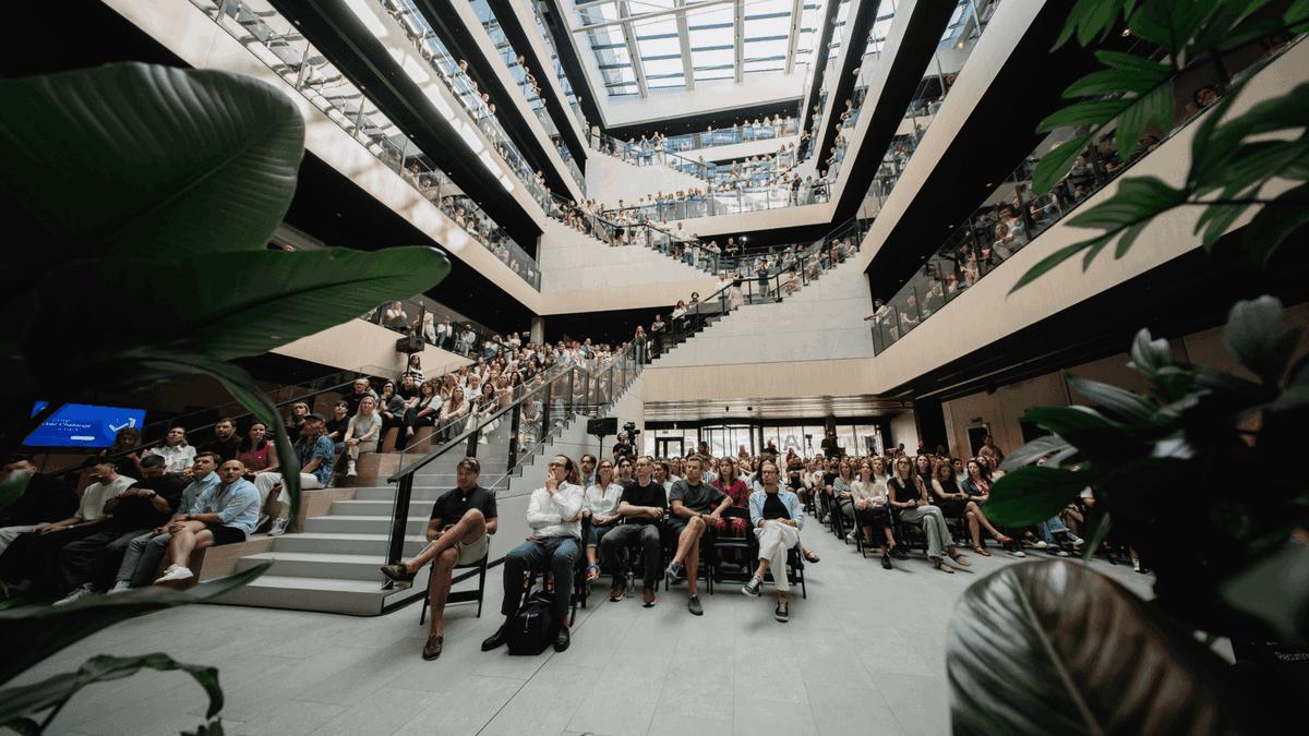Employees gathered in the atrium of the Nord Security Cyber City office.