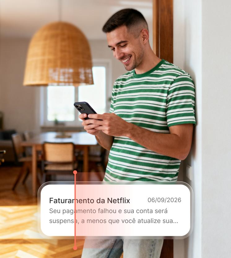A man reads a suspicious billing text on his smartphone, which may be a phishing attempt. 