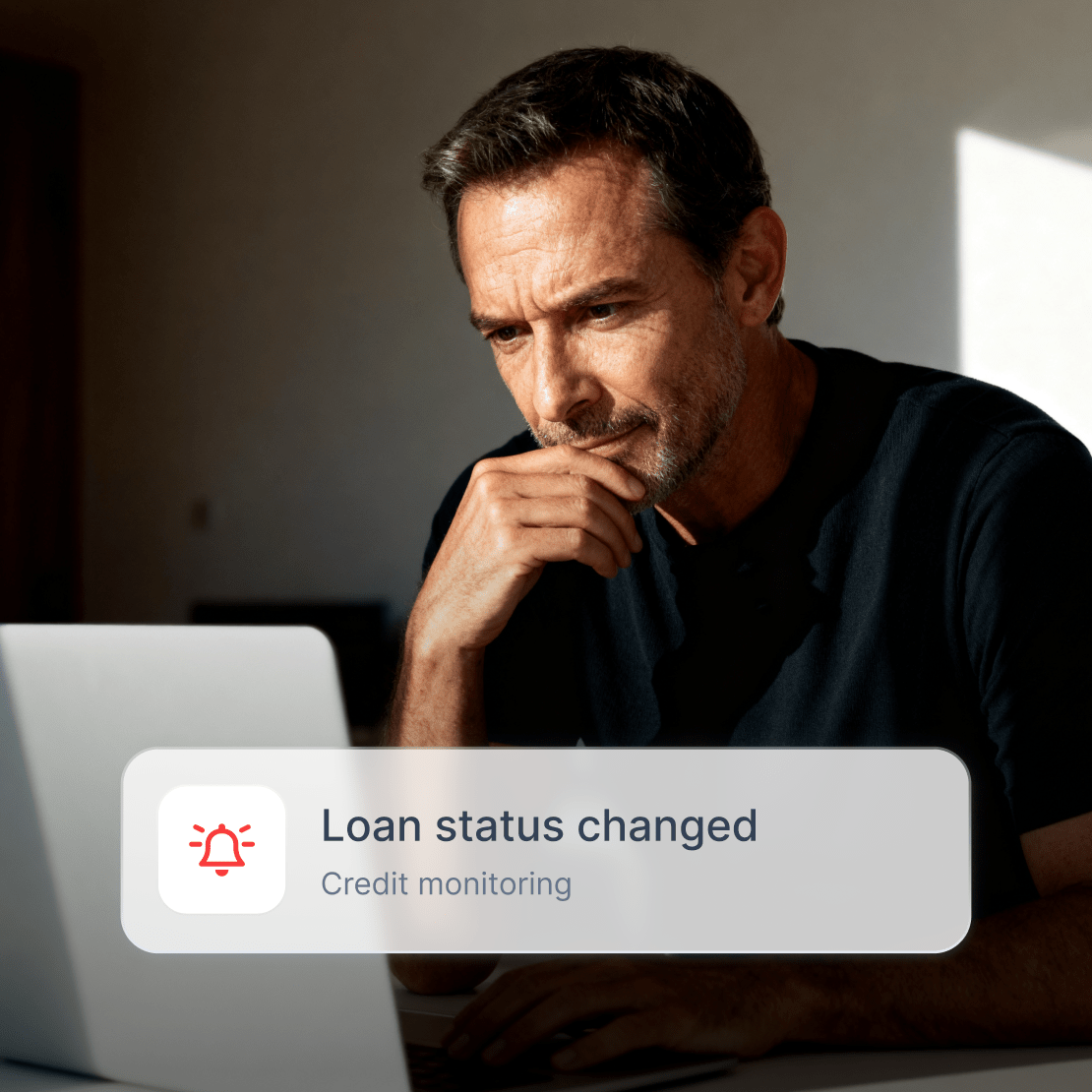 A person receiving a Coveron alert about a loan status change.