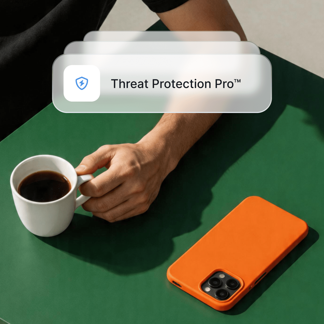 A person drinking coffee while protected by NordVPN’s Threat Protection Pro™.