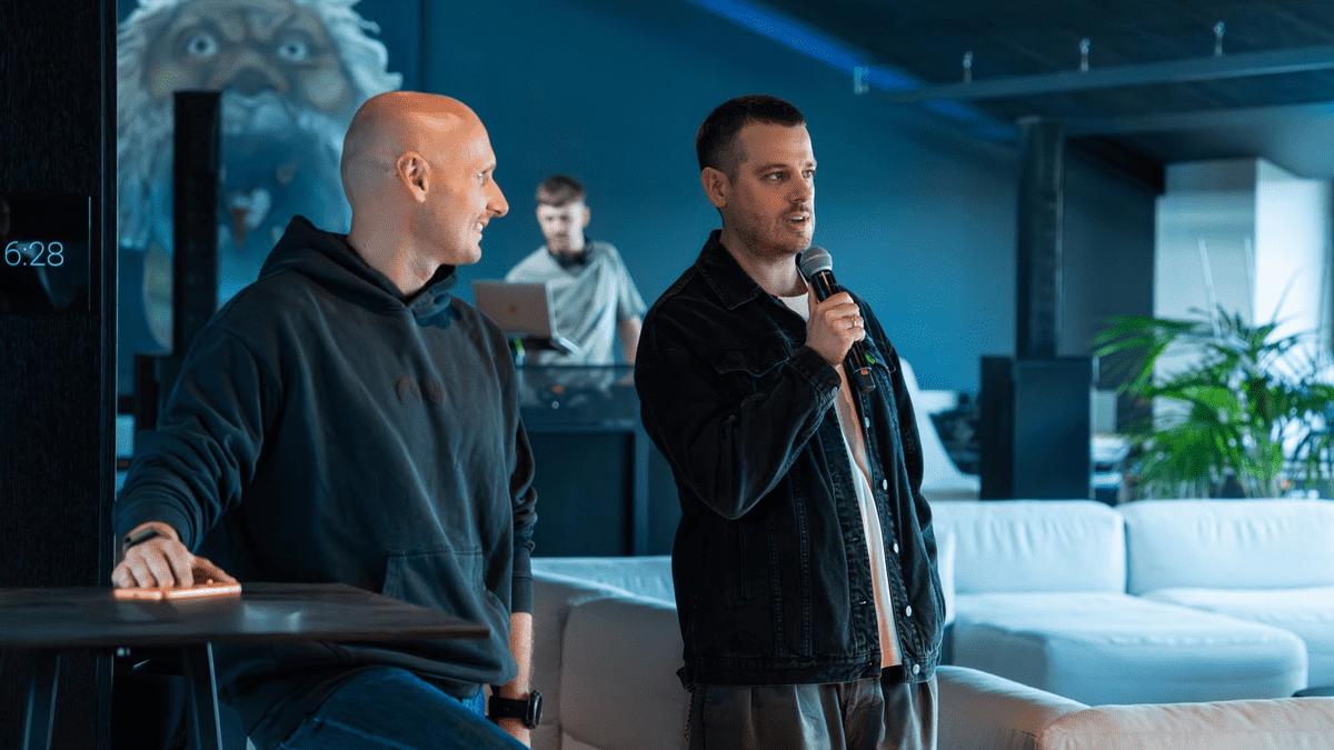 Nord Security co-founders addressing employees at a company event.