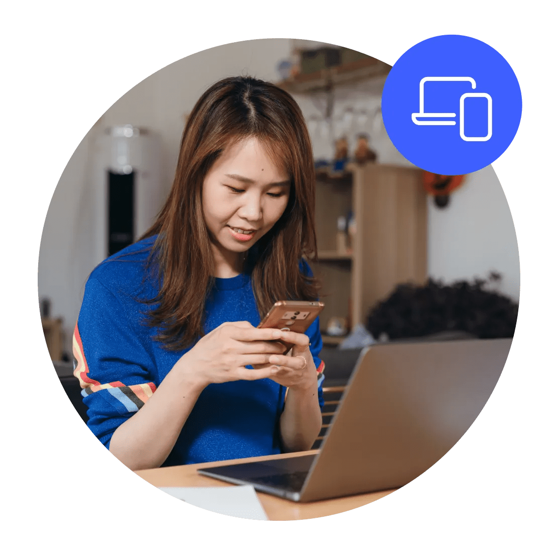 A woman connecting her laptop and phone to her VPN client.