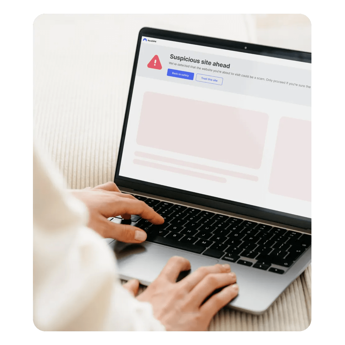 Scam and fraud detection alerts a user about a suspicious site ahead on their computer.