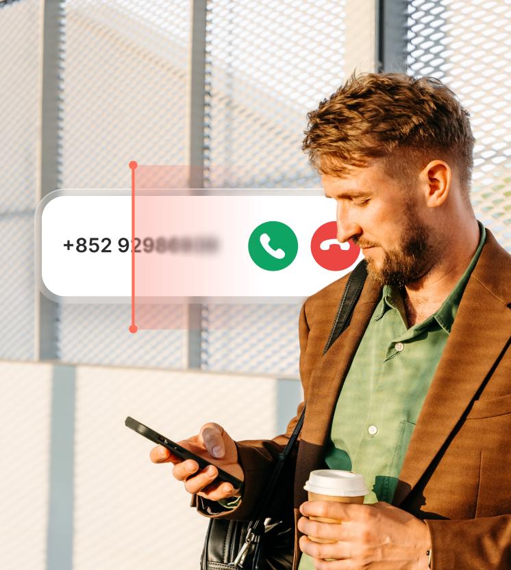 A man receives a suspicious call as the spam call blocker scans the caller’s number. 