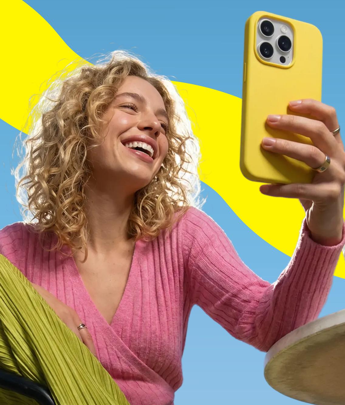 Woman using the Saily eSIM app while traveling.