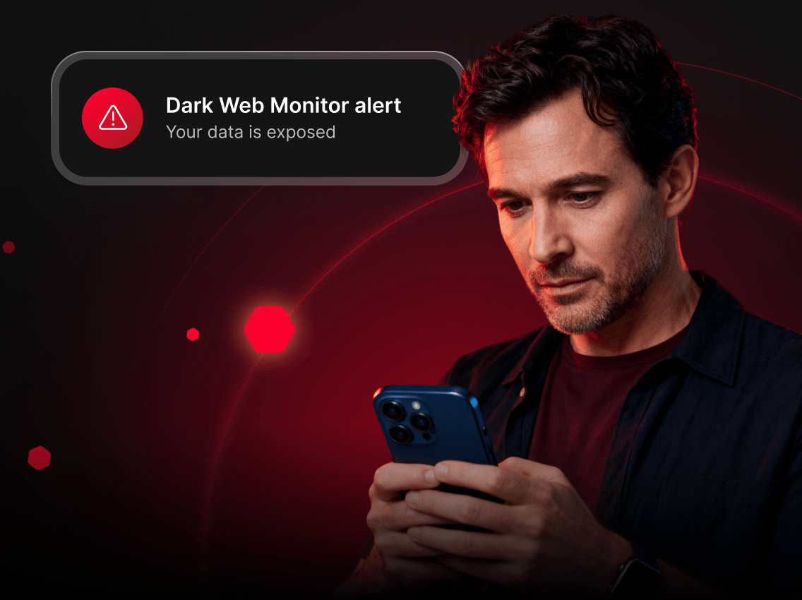 A man getting a Dark Web Monitor alert about exposed data.