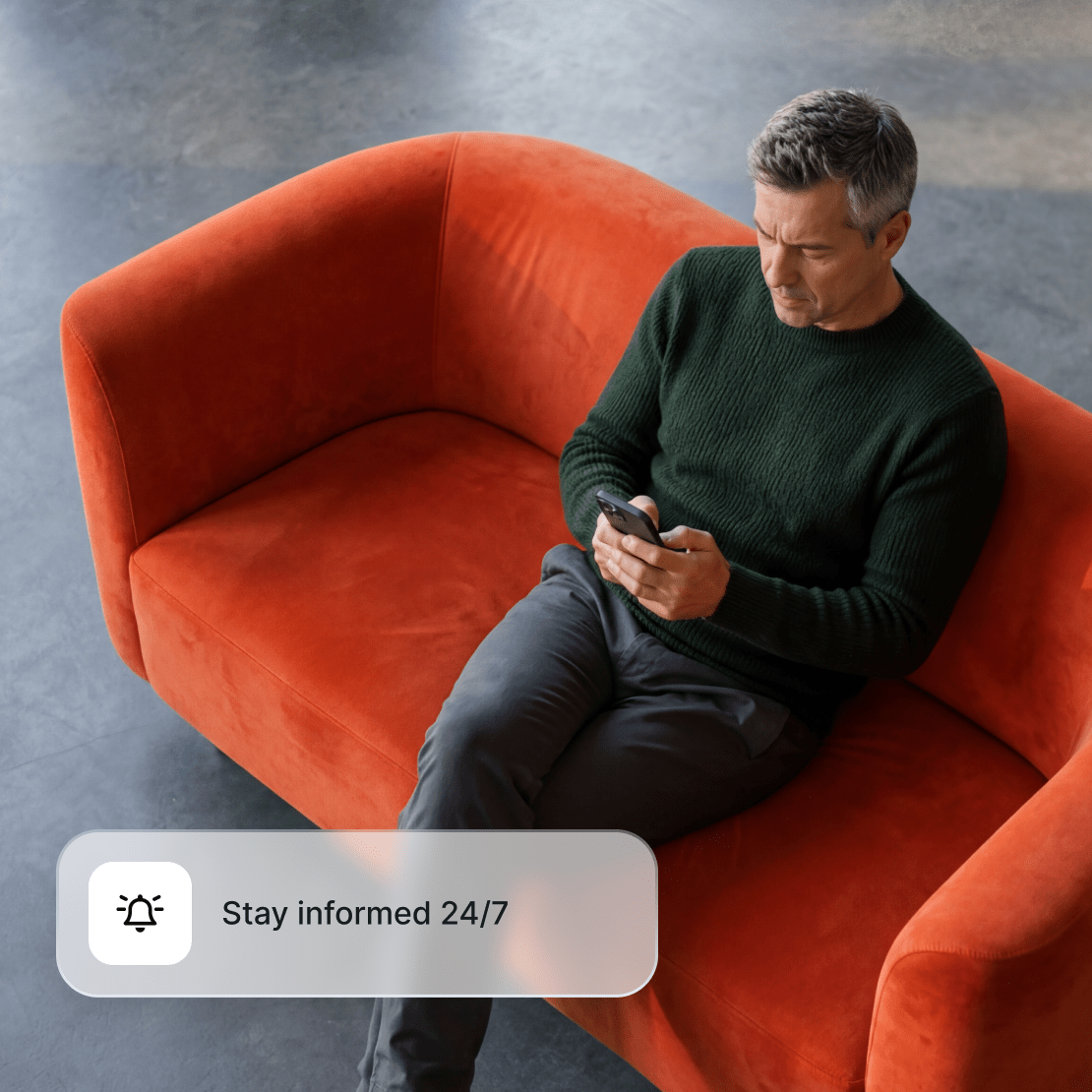 A person using Coveron’s Criminal record monitoring on their phone to stay informed about potential cyber risks 24/7.