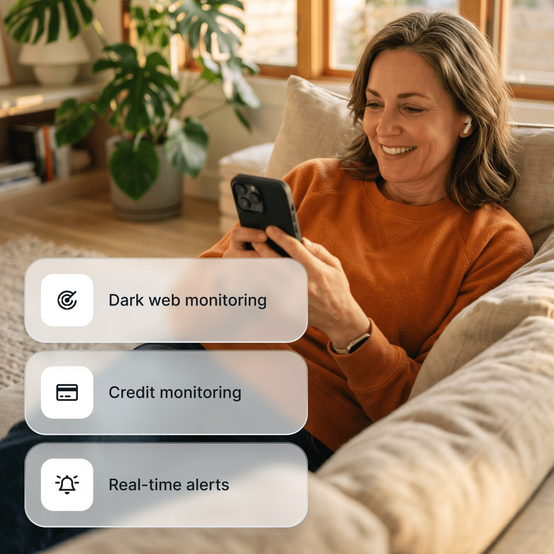 A person checking Coveron’s dark web monitoring, real-time alert, and credit monitoring features on their phone.