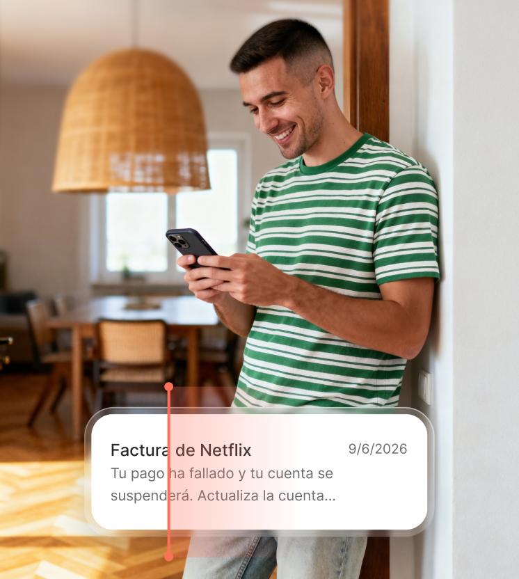 A man reads a suspicious billing text on his smartphone, which may be a phishing attempt. 