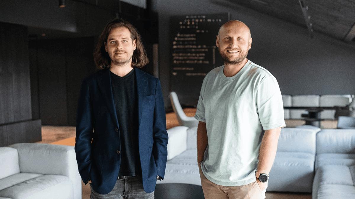 Nord Security co-founders standing in the office lounge.