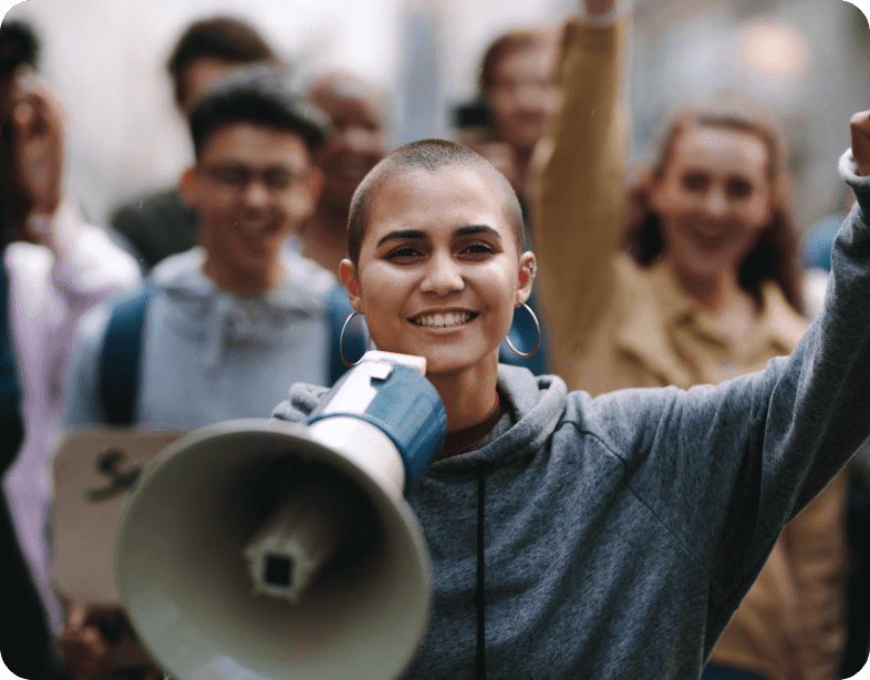 young woman leading protest megaphone