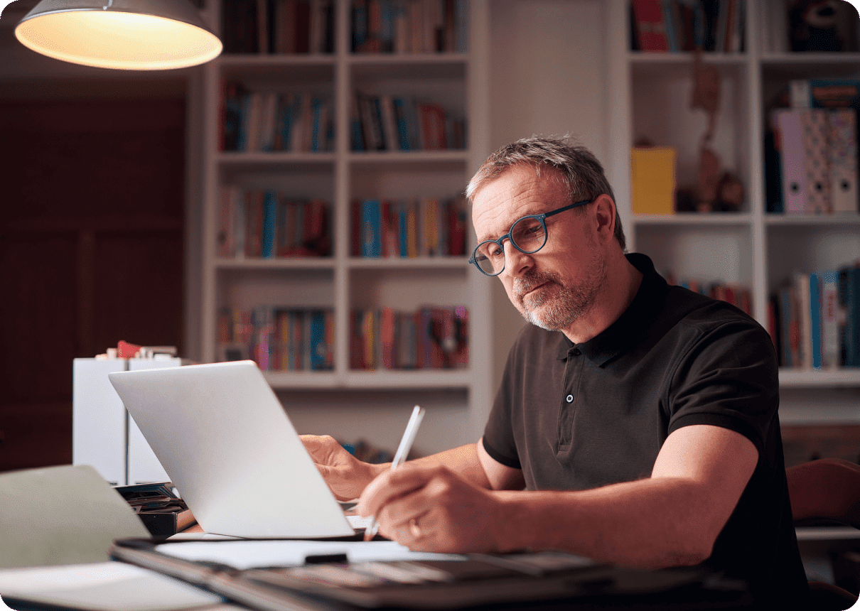 A man with a laptop using NordVPN educational tools