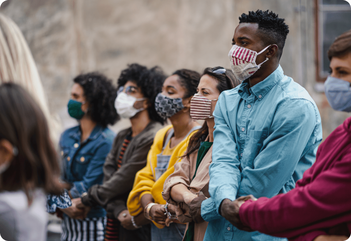 diverse protestors holding hands