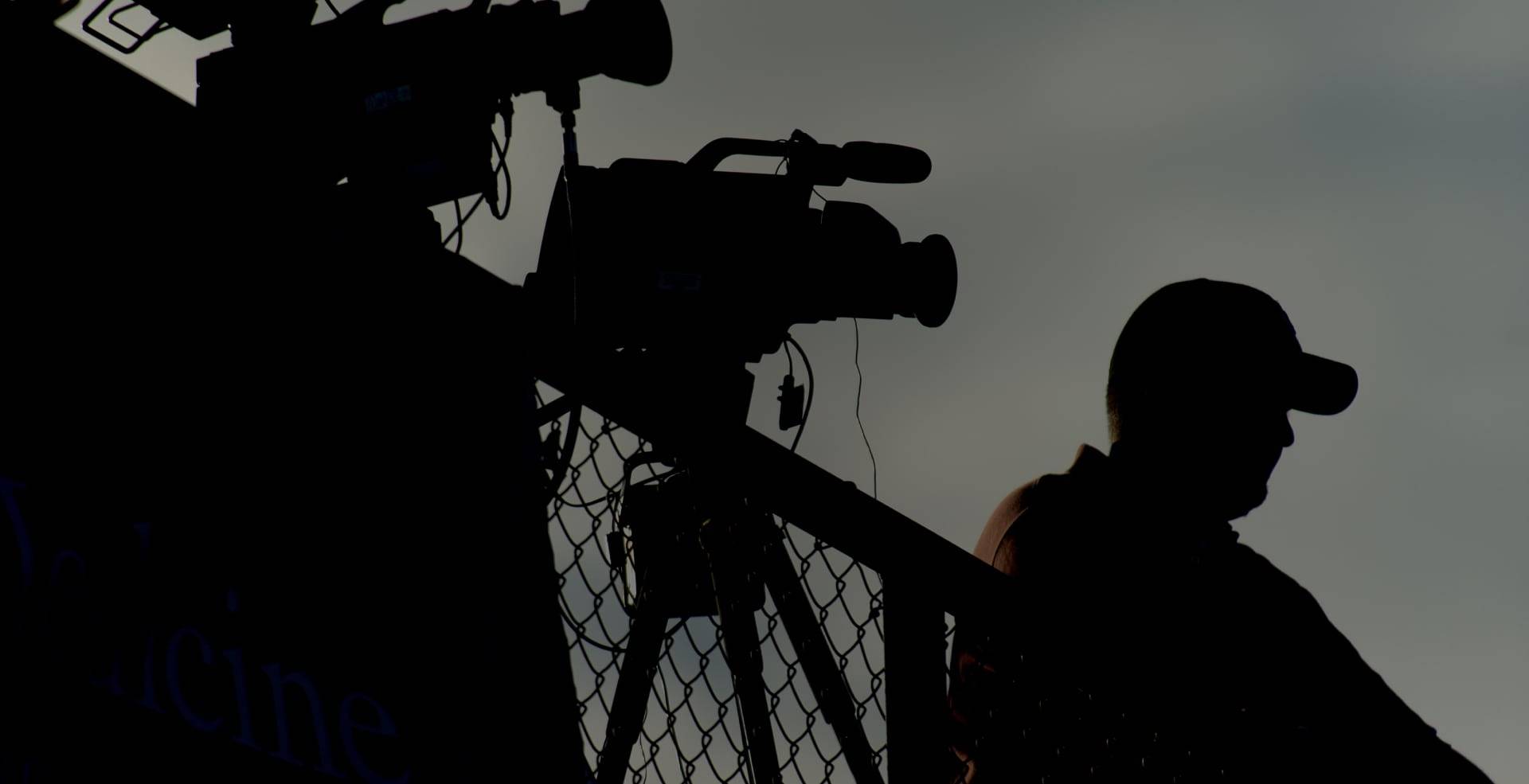 hero journalist camera fence